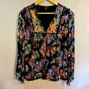 Embroidered multi-colored peasant blouse.